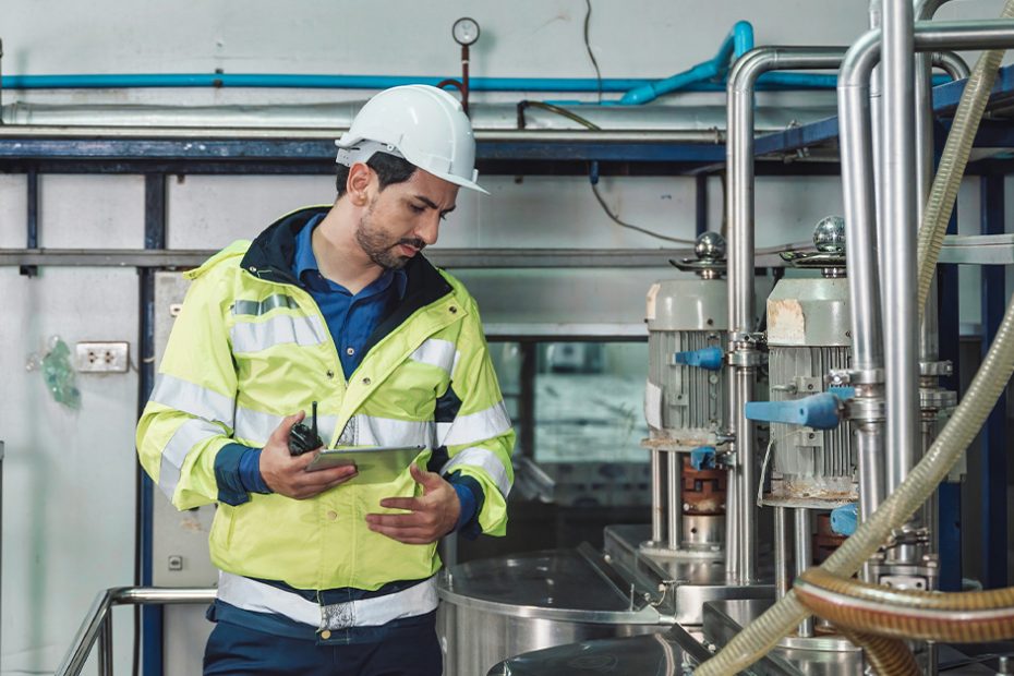 worker surveying fluid safety